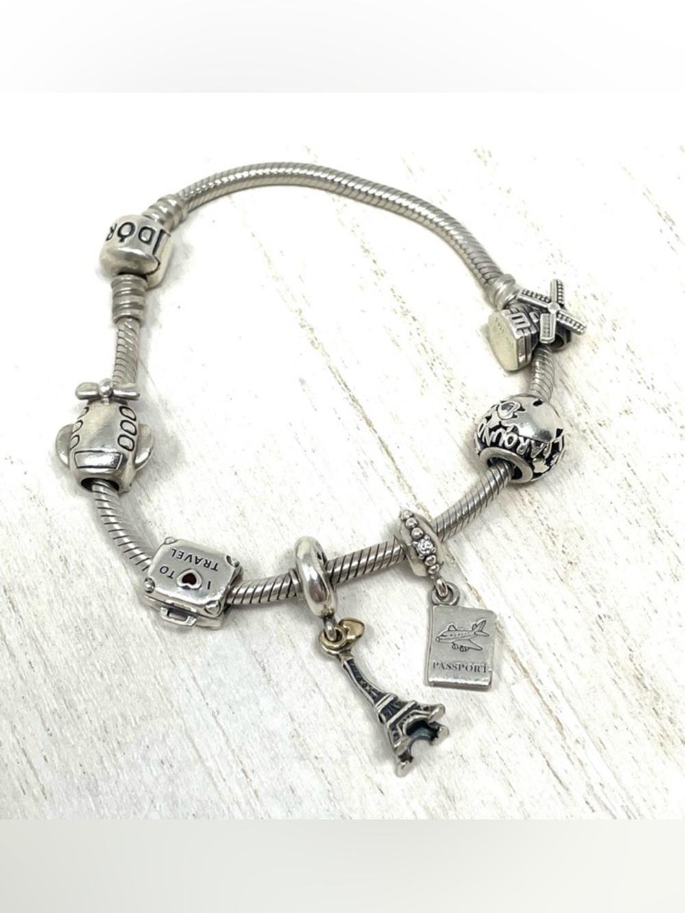 PANDORA  “travel” themed 6 charm sterling silver bracelet